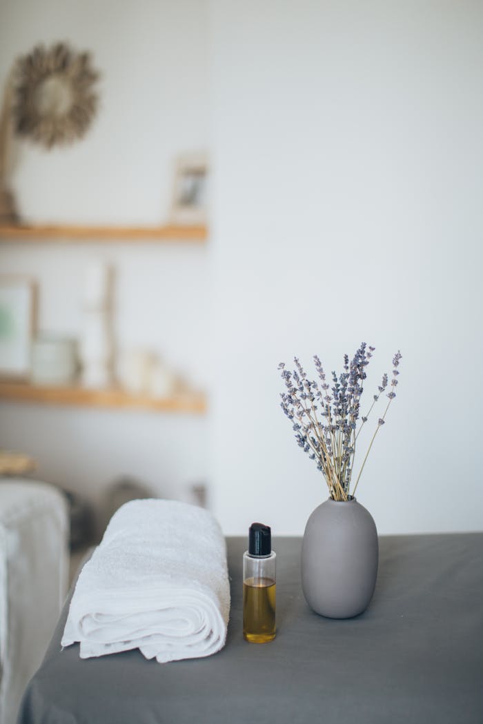 gallery-1 Relaxing spa scene featuring lavender, towel, and oil for a calming experience.
